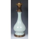 A 19th century celadon baluster table oil lamp,