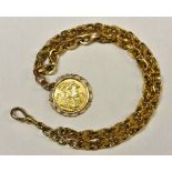 A 9ct gold fancy link Albert chain necklace suspending a George V 1911 full sovereign, 23cm long,