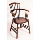 A 19th century elm Windsor elbow chair, shaped cresting rail, saddle seat, outswept legs,