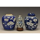 A Chinese double gourd vase, painted in underglaze blue with birds, butterflies and flowers,