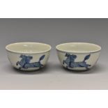 A pair of Chinese porcelain circular tea bowls,