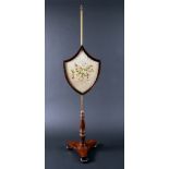 A 19th century mahogany pole screen,