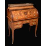 A 19th century French gilt metal mounded mahogany, rosewood and marquetry bureau à cylindre,