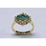 A emerald, diamond and sapphire cluster ring,