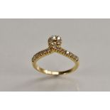 A diamond loop ring, single loop crest, linear set with eighteen round cut diamonds,