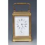 A late 19th century French gilt brass repeating carriage clock,