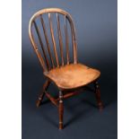 A 19th century elm child's stick back chair, saddle seat, turned legs, H-stretchers, 62cm high, c.