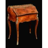 A Louis XV revival gilt metal mounted kingwood and walnut bombe shaped bureau du dame,