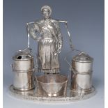 A Victorian E.P.N.S novelty figural cruet, as a milk maid with yoke, churns and pail, oval base, 14.