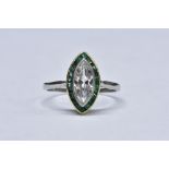 A diamond and emerald ring, central marquise cut diamond approx 1.