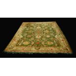 A large Ushak Turkey woollen carpet, green ground, 415cm 338cm, c.