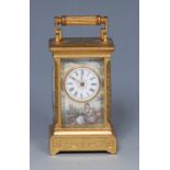 A late 19th/early 20th century miniature gilt metal and enamelled carriage clock,