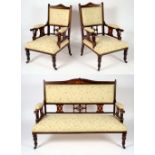 A late Victorian rosewood and marquetry three piece salon suite comprising sofa and pair of