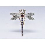 A diamond, emerald, sapphire and ruby dragonfly brooch, shaped arching sapphire tail,