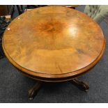 A Victorian walnut breakfast table, oval quarter veneered top, cockbeaded frieze,