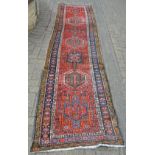 An Antique Persian Heriz runner 334 x 79cm