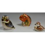 A Royal Crown Derby paperweight, Squirrel, printed mark, gold stopper; others,