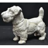 A reproduction cast metal figure of West Highland White Terrier dog