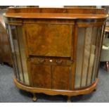 A 20th century mahogany and walnut veneered bow fronted bureau/ side by side,