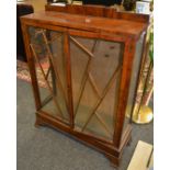 A 1920's walnut display cabinet, astragal glazed doors. 122cm high x 90cm wide x 30cm deep.