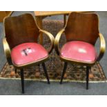 A pair of unusual teak tub chairs c 1960