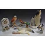 A Country Artists model of a Emperor penguin and chick; a Goebel model of a bird of prey;