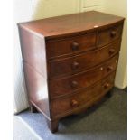 A George III bow front mahogany chest of two short drawers above three long drawers, c.