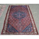 An antique Persian Kurdish rug 195 x 135cm