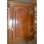 A George III oak corner cabinet c1820