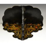 A pair of early 20th century Japanese black lacquer folding wall shelves,