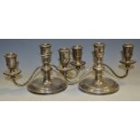 A pair of silver three light boudouir candleabras,