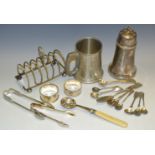 A silver napkin ring; another; plated ware - a toast rack, mustard spoons,