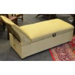 An early 20th century day bed, hinged cover enclosing storage cavity, Art Nouveau oversized handle,