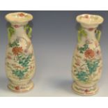 A pair of Aesthetic Movement baluster shaped spill vases, profusely painted throughout,