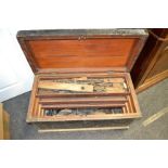 A pine tool chest, handles to side, 3 graduated removable shelves; various tools including planes,