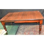 A Victorian mahogany wind out table, reeded legs, c.