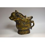 A cast metal verdigris patinated vessel and cover, as a mythical creature,