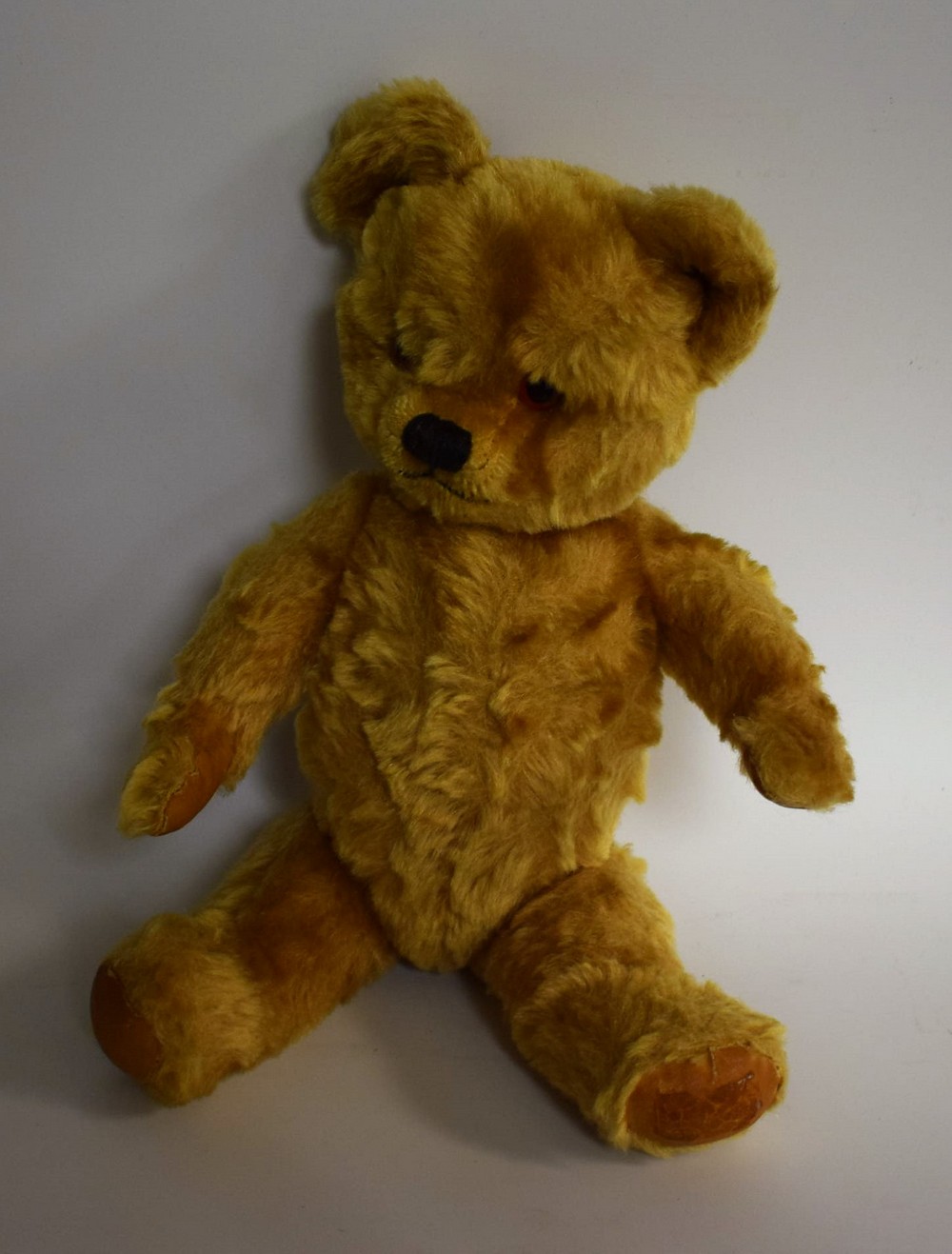 A jointed mohair teddy bear,