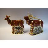 A Royal Crown Derby paperweight, The Sherwood Stag, silver stopper; another, The Sherwood Hind,