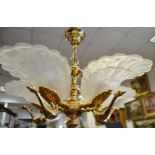 A Contessa Dorchester five branch gilt brass chandelier in the form of peacocks with Murano glass