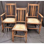 A pair of oak rush seat carver armchairs;