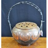 An Arts and Crafts copper vase, wrought iron handles,