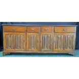 A Rupert Griffiths Arts and Crafts inspired oak sideboard,