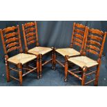 A set of four oak rush seated Country Kitchen chairs