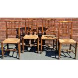 A set of four early 20th century rush seated dining chairs