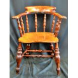 A Victorian elms and beech smokers bow armchair by William Aldridge of High Wycombe (trademarked