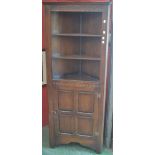 An oak corner cupboard