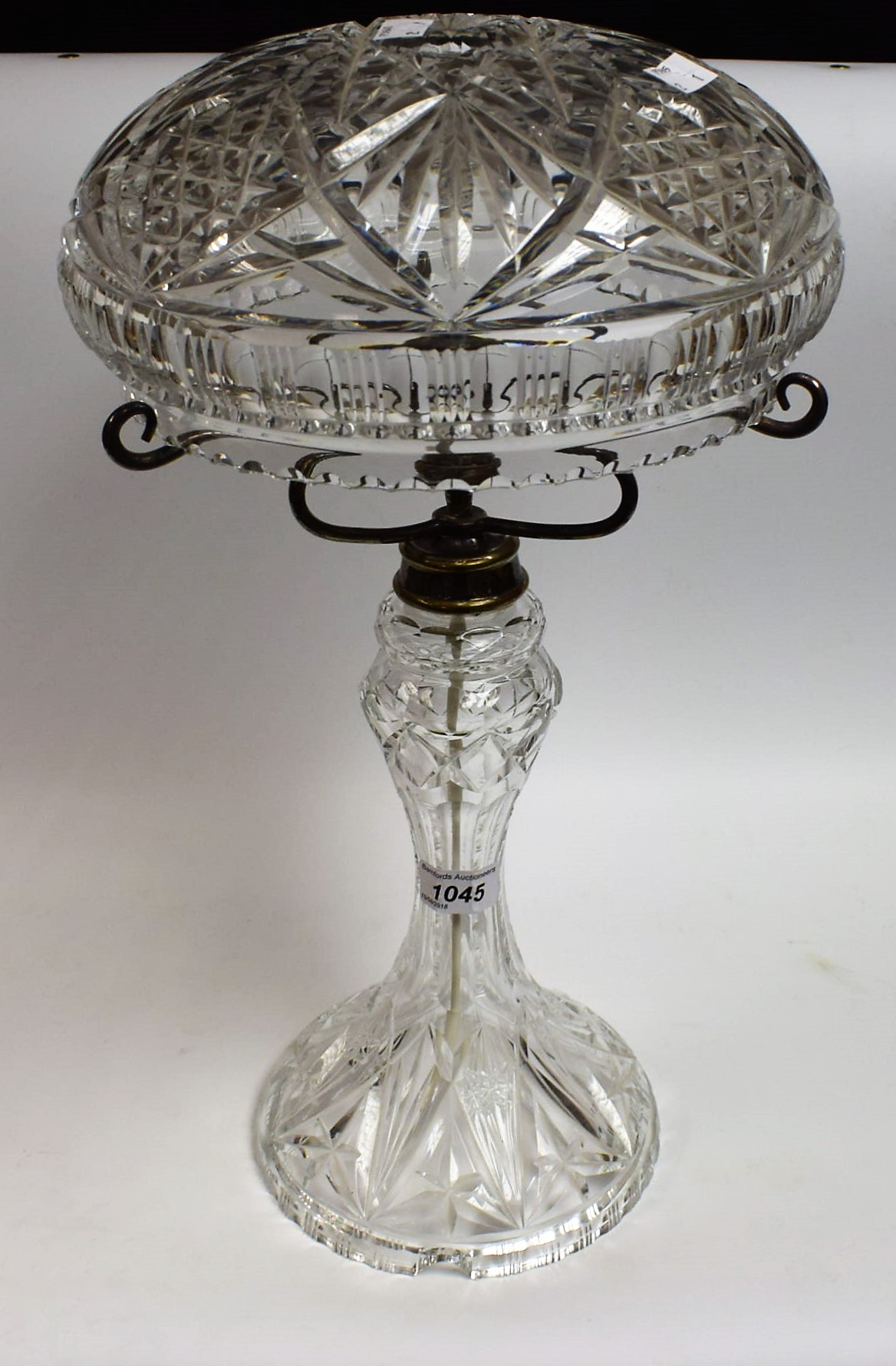 A mid-20th century cut crystal table lamp and shade, approx.