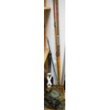 Fishing - a mahogany brass mounted fishing reel; other reels; fishing rods,