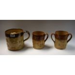 A 19th century Denby salt glazed stoneware porter mug, in relief with jolly topers,